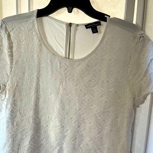 White appliqué blouse